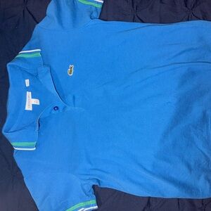 Blue Polo Shirt with Green and White Trim